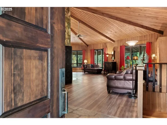 a view of a room with wooden floor