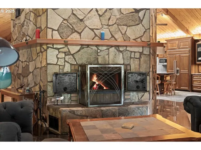 a dining room with furniture and fireplace