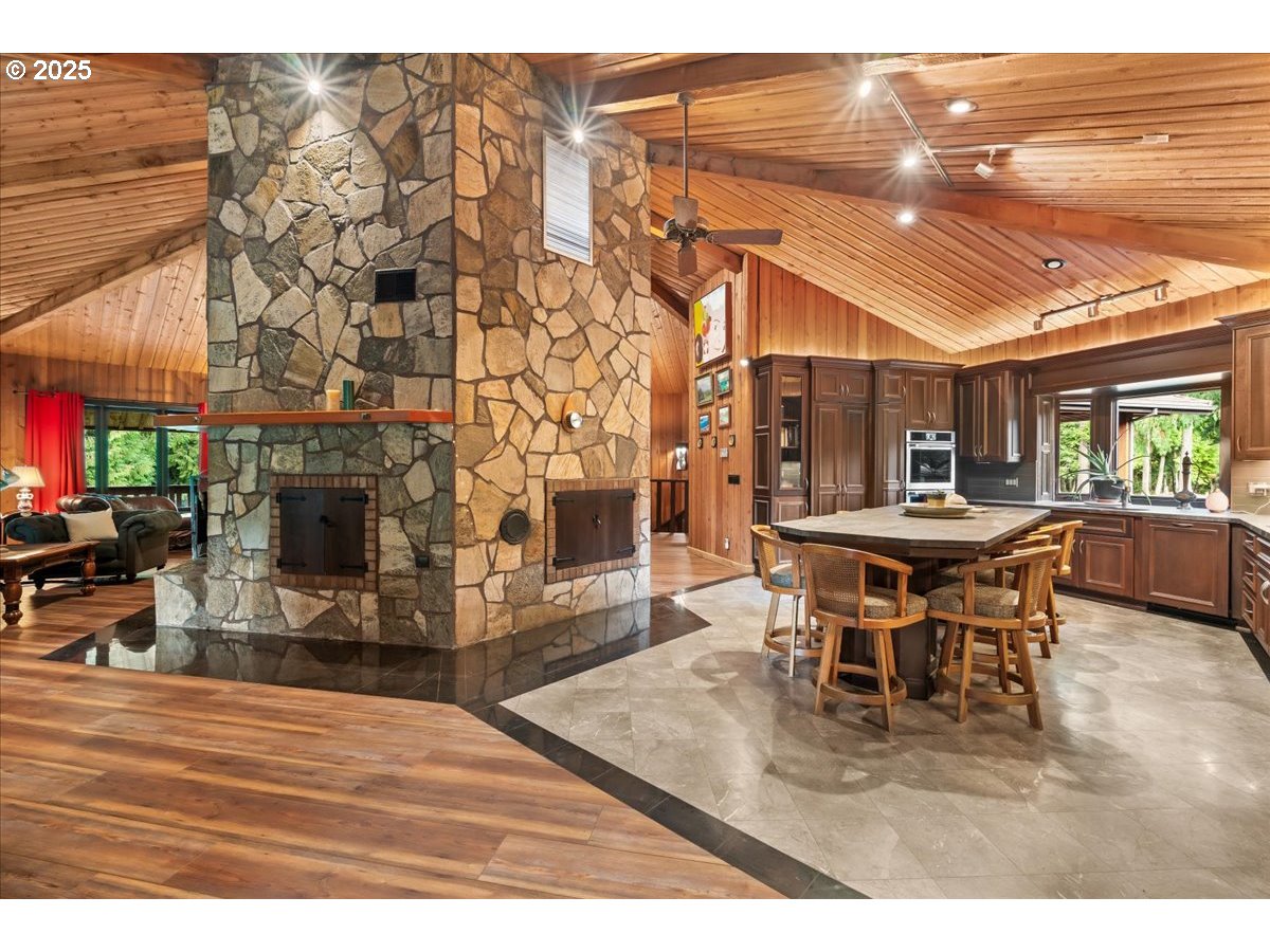 51720 Northwest Hayward Road Manning, OR 97125 - Photo 10 of 48 a dining room with furniture and fireplace