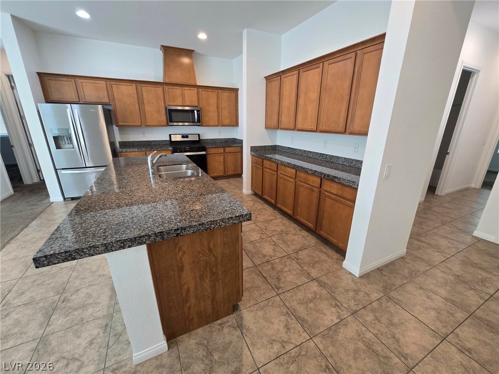 4748 Ritual Street North Las Vegas, NV 89031 - Photo 24 of 31 A well-appointed kitchen showcasing durable granite counters and ample storage.