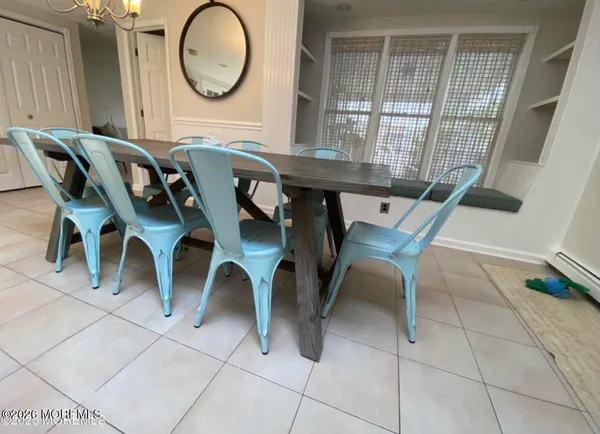 a living room with furniture and a lamp