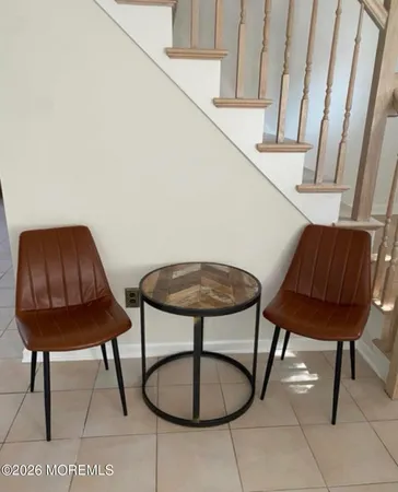 a bedroom with two beds and painting on the wall