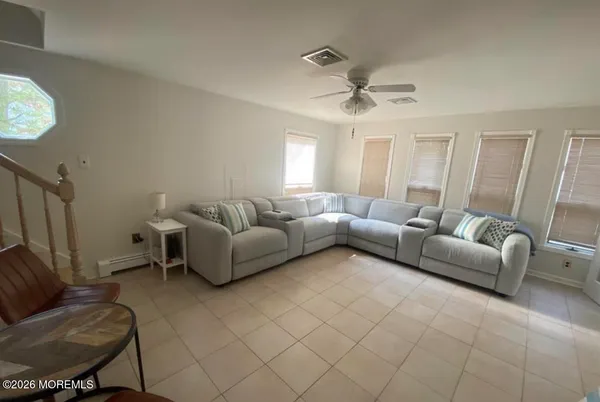 a bedroom with two beds and a window