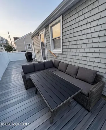 a view of balcony with wooden floor