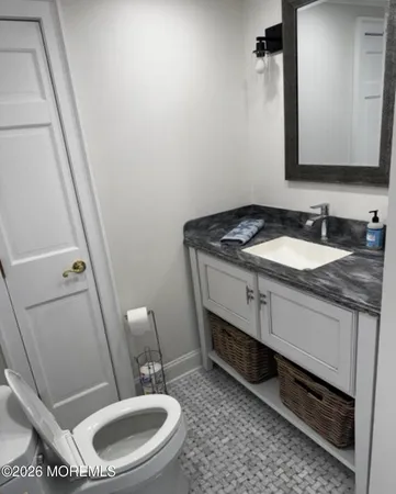 a view of a dining room with furniture and a chandelier
