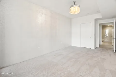 a view of walk in closet with clothes