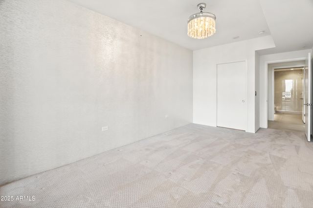 a view of walk in closet with clothes