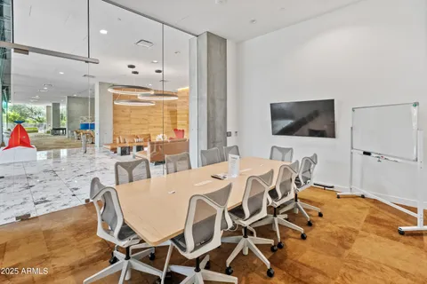 a kitchen with stainless steel appliances kitchen island granite countertop a stove and a wooden floor