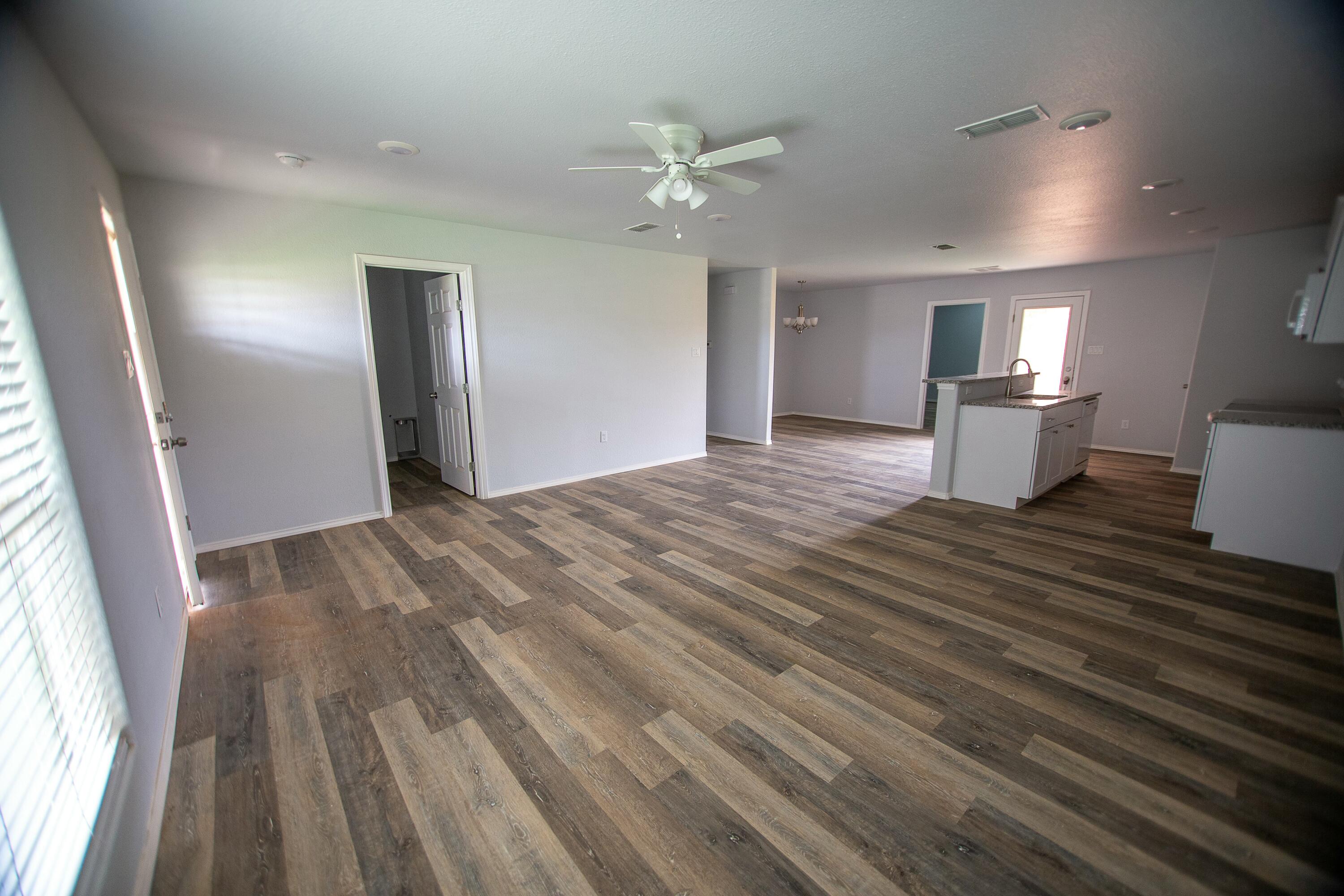 8613 10th Place Lubbock, TX 79416 - Photo 5 of 9 a view of a kitchen from the hallway