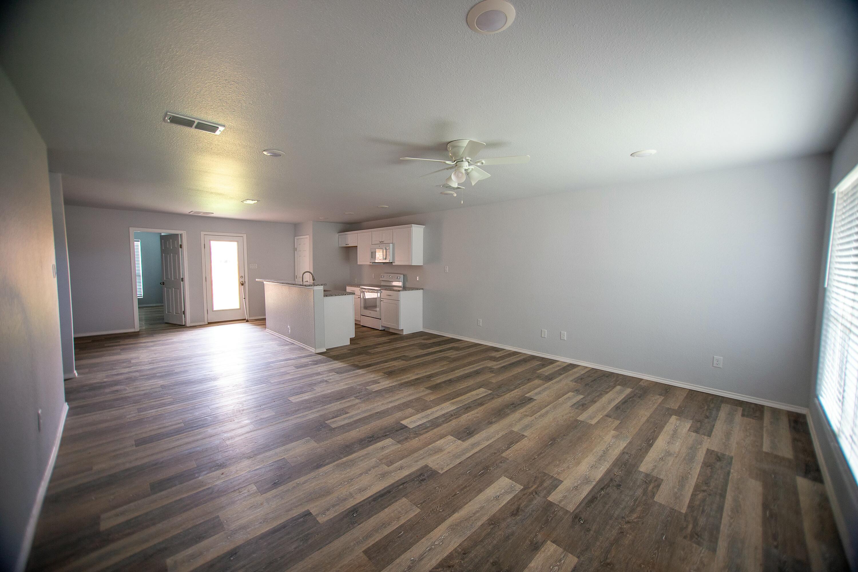 8613 10th Place Lubbock, TX 79416 - Photo 8 of 9 a view of empty room with wooden floor