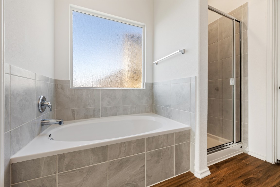 132 Joe Kidd Lane, Unit 132 Jarrell, TX 76537 - Photo 23 of 40 a white bath tub sitting next to a white sink