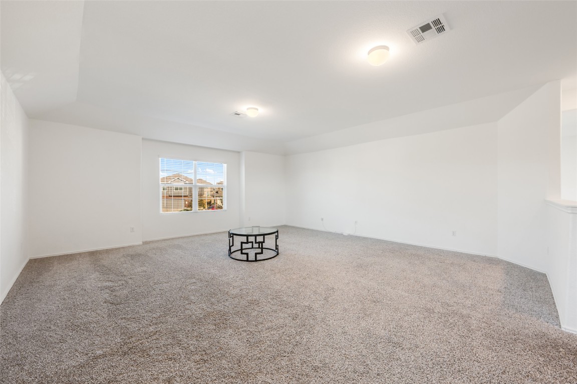 132 Joe Kidd Lane, Unit 132 Jarrell, TX 76537 - Photo 28 of 40 an empty room with a wall and a window