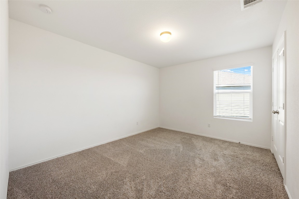 132 Joe Kidd Lane, Unit 132 Jarrell, TX 76537 - Photo 31 of 40 an empty room with a window