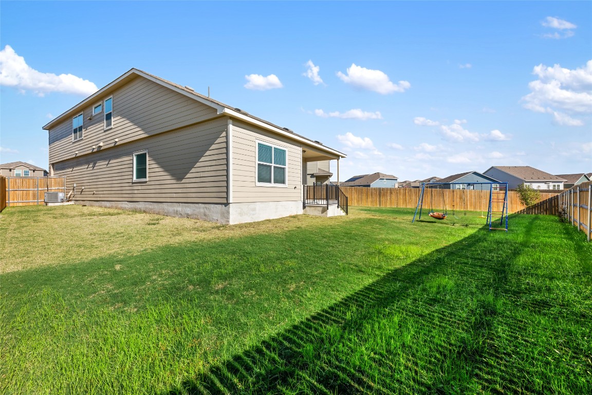 132 Joe Kidd Lane, Unit 132 Jarrell, TX 76537 - Photo 37 of 40 a front view of house with yard and green space