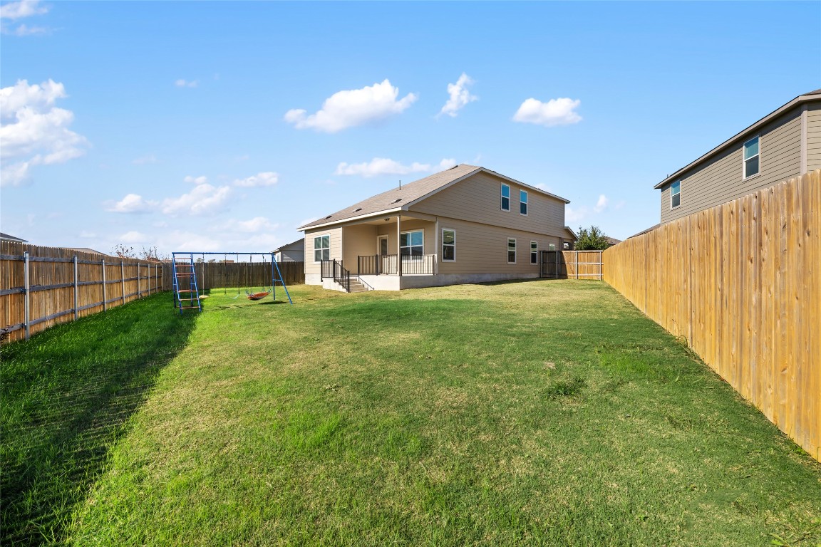 132 Joe Kidd Lane, Unit 132 Jarrell, TX 76537 - Photo 38 of 40 a view of a house with backyard and porch