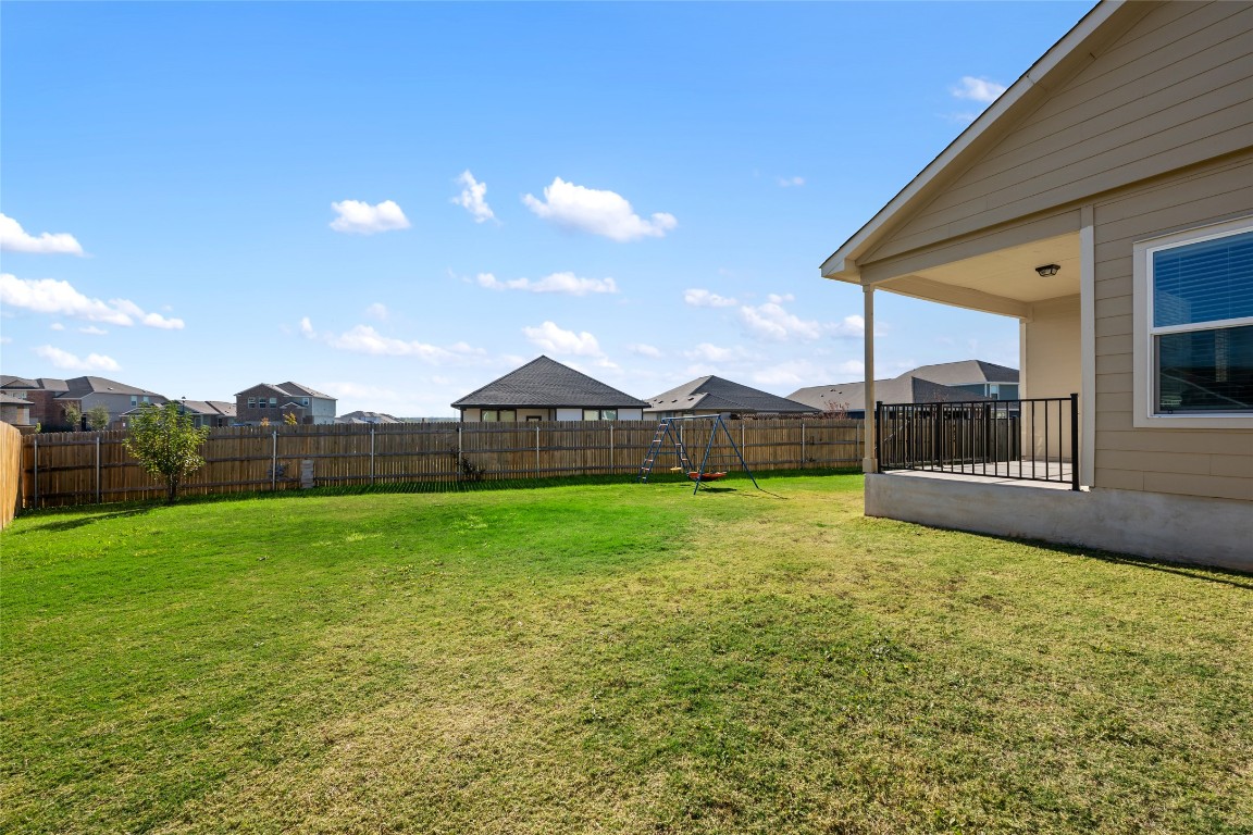 132 Joe Kidd Lane, Unit 132 Jarrell, TX 76537 - Photo 39 of 40 a view of a back yard of the house