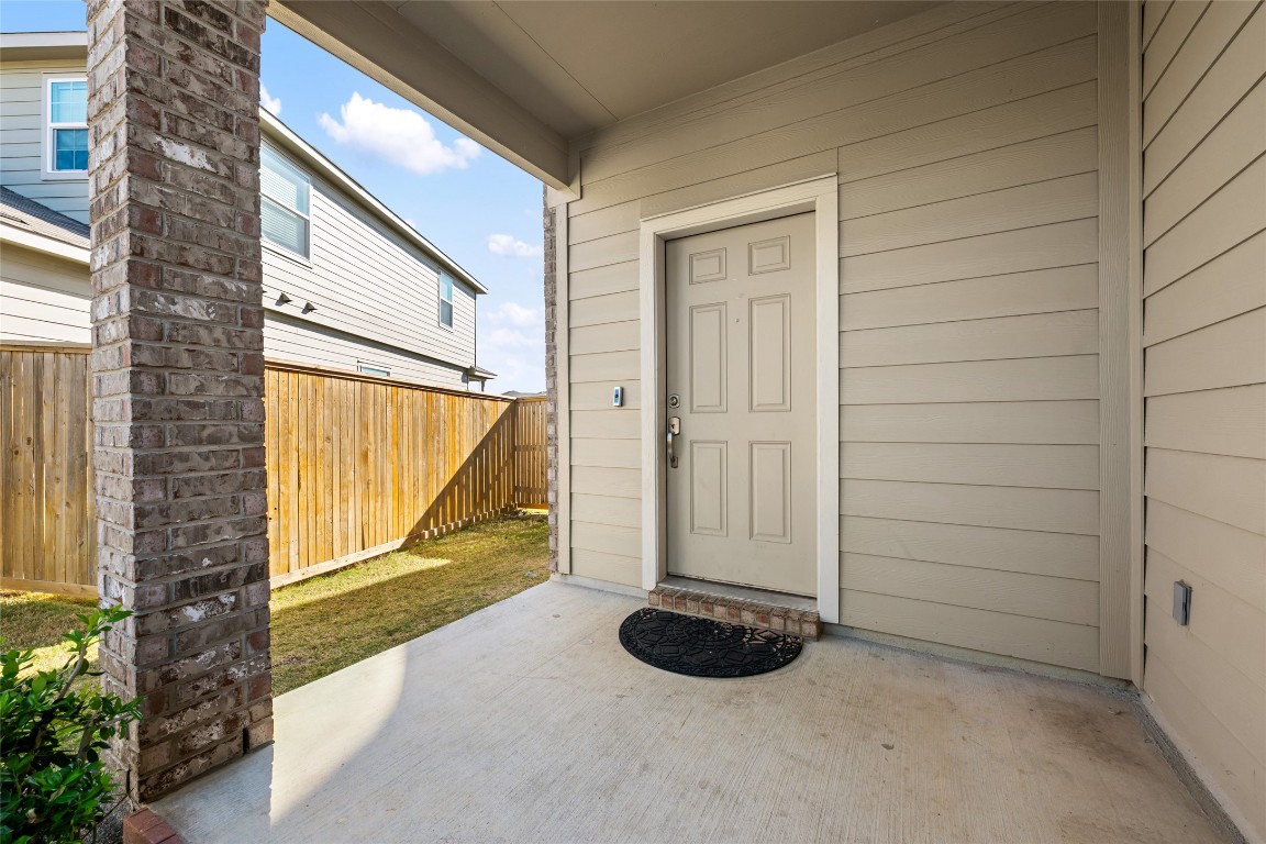 132 Joe Kidd Lane, Unit 132 Jarrell, TX 76537 - Photo 4 of 40 a view of a door and wooden floor