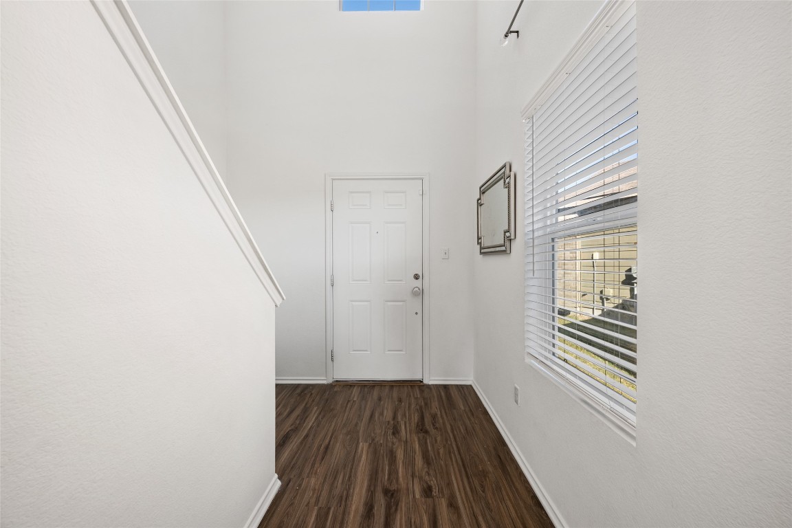 132 Joe Kidd Lane, Unit 132 Jarrell, TX 76537 - Photo 6 of 40 a view of room with wooden floor