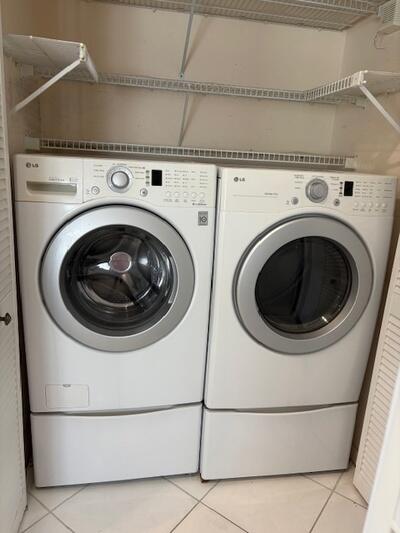4772 Navigator Lane Boynton Beach, FL 33436 - Photo 11 of 44 a utility room with dryer and washer