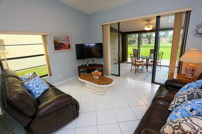 4772 Navigator Lane Boynton Beach, FL 33436 - Photo 14 of 44 a living room with furniture and a flat screen tv