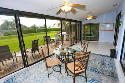 4772 Navigator Lane Boynton Beach, FL 33436 - Photo 16 of 44 a view of a dining room with furniture window and outside view