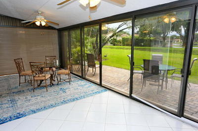 4772 Navigator Lane Boynton Beach, FL 33436 - Photo 17 of 44 a view of a porch with chairs and backyard