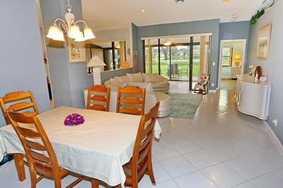 4772 Navigator Lane Boynton Beach, FL 33436 - Photo 19 of 44 a dining room with furniture and a large window