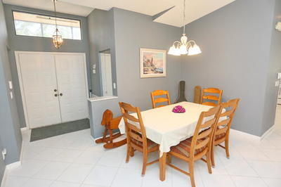 4772 Navigator Lane Boynton Beach, FL 33436 - Photo 20 of 44 a dining room with furniture and window
