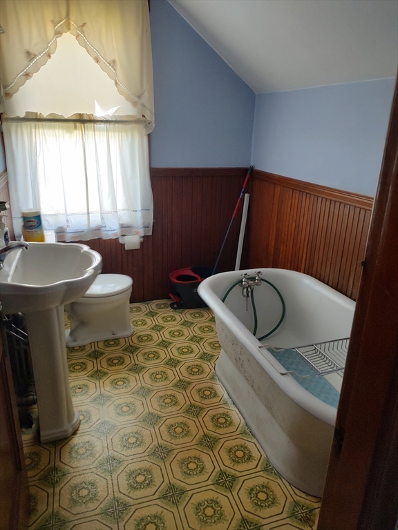 577 County Street Taunton, MA 02780 - Photo 12 of 23 a bathroom with a sink toilet and window