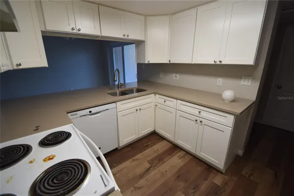 a kitchen with a sink and cabinets