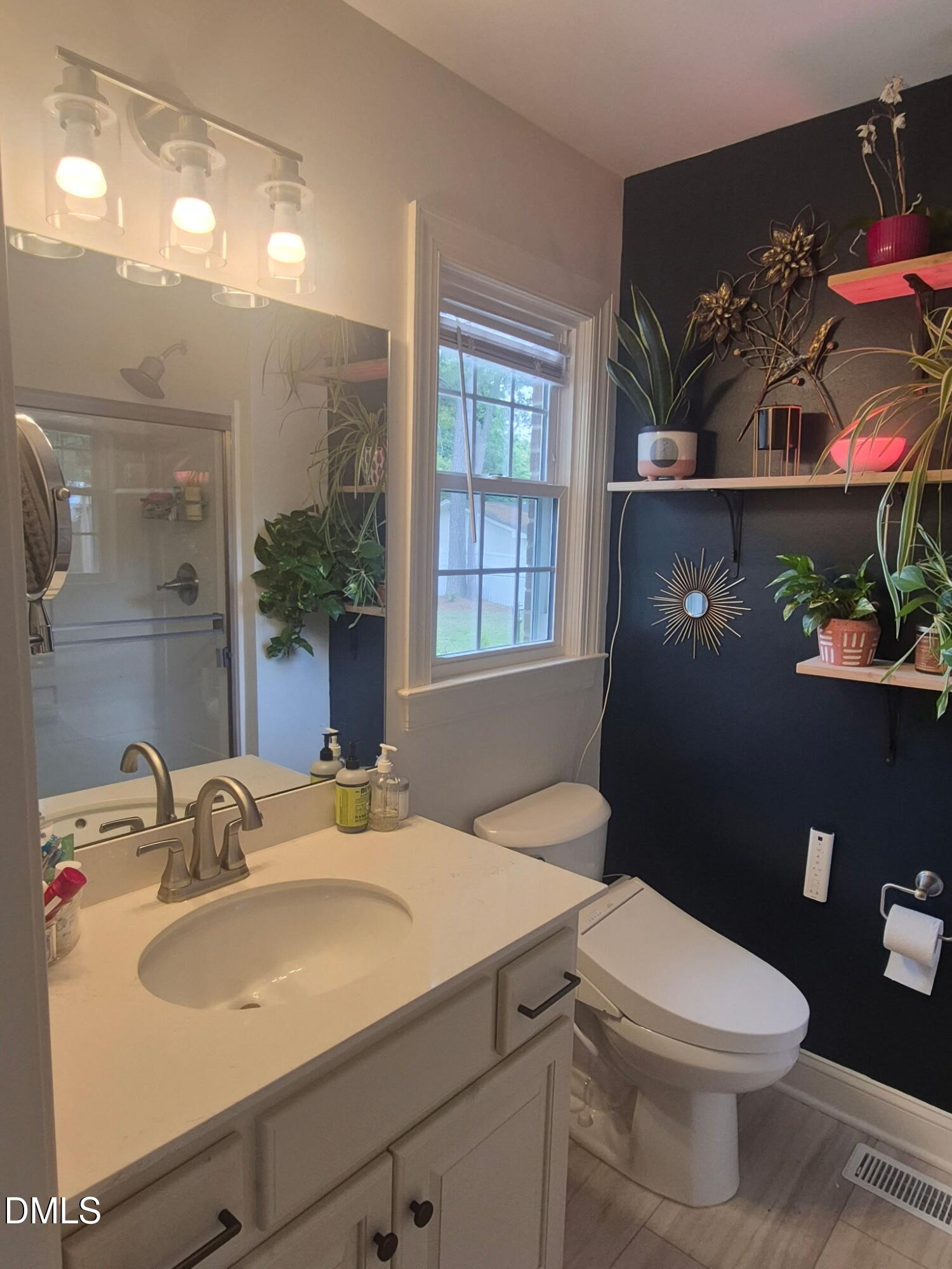 1219 Queen Anne Road Northwest Wilson, NC 27896 - Photo 5 of 26 a bathroom with a sink vanity granite and toilet