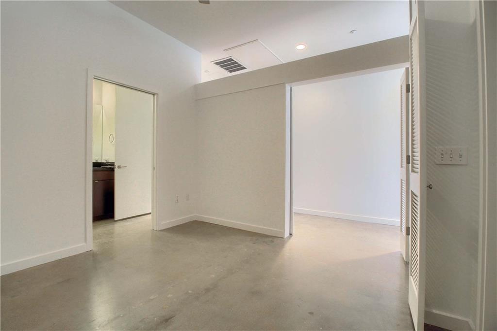 507 Sabine Street, Unit 602 Austin, TX 78701 - Photo 9 of 22 an empty room with closet area