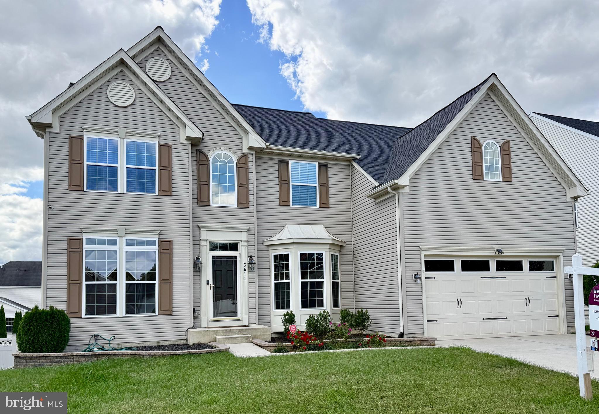 front view of a house with a yard