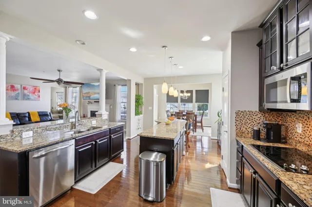 a view of a dining room with furniture and chandelier