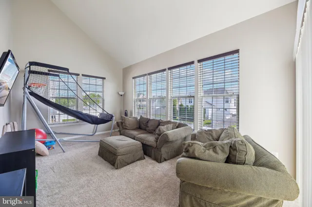 a bathroom with a toilet a sink and a mirror