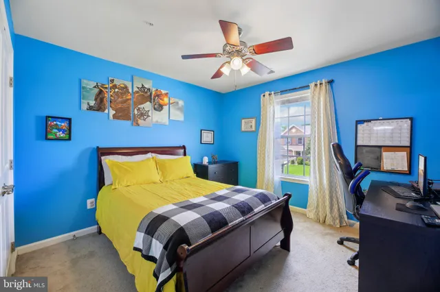 a bathroom with a sink a toilet and a large mirror
