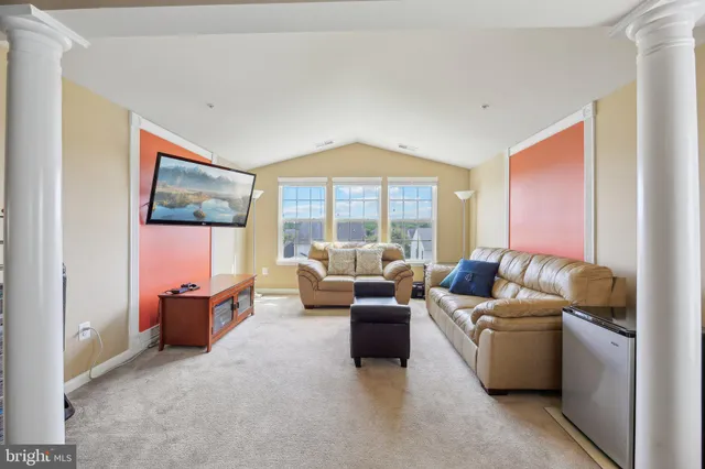 a bed room with a bed and a large window