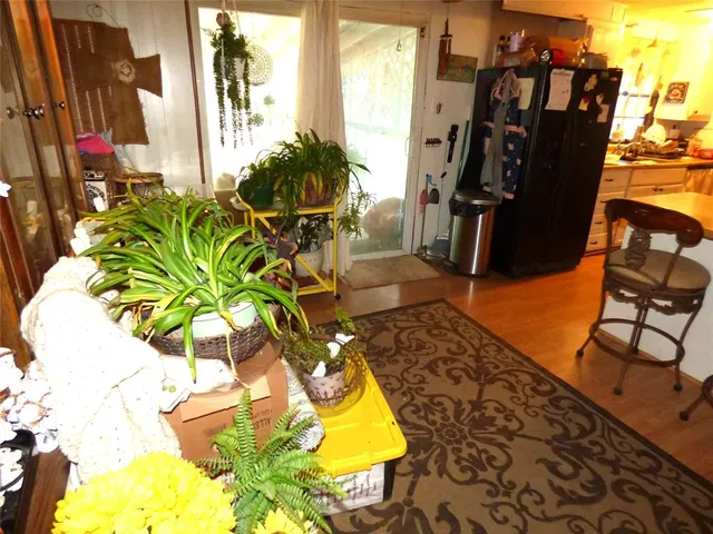 a kitchen that has a lot of furniture and storage