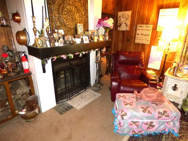 a living room with furniture fireplace and a flat screen tv