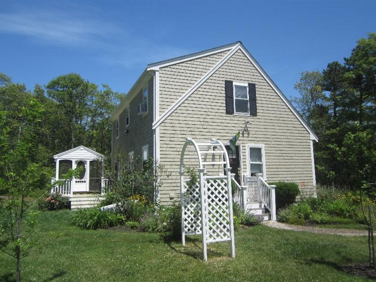 5 Cotuit Road Sandwich, MA 02563 - Photo 2 of 34 a front view of a house with garden