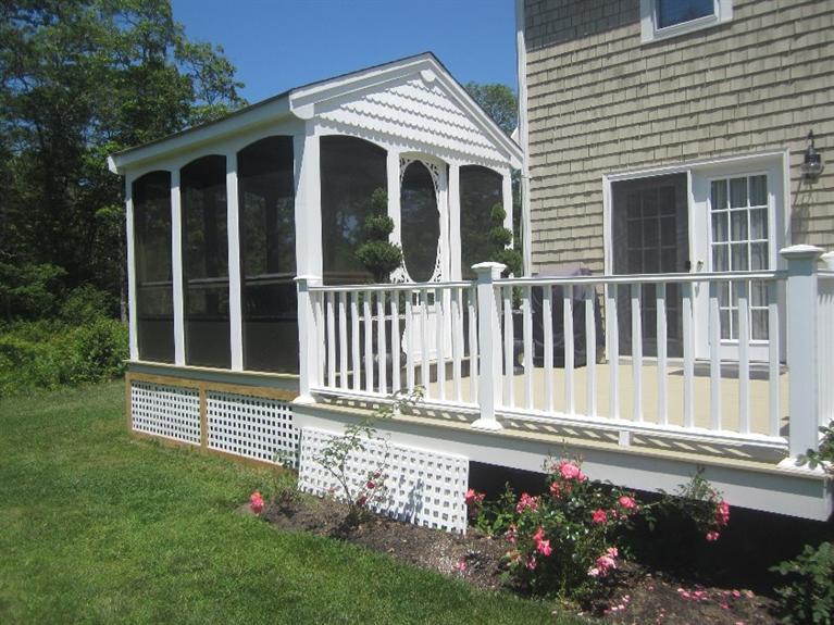 5 Cotuit Road Sandwich, MA 02563 - Photo 25 of 34 a front view of a house with a yard
