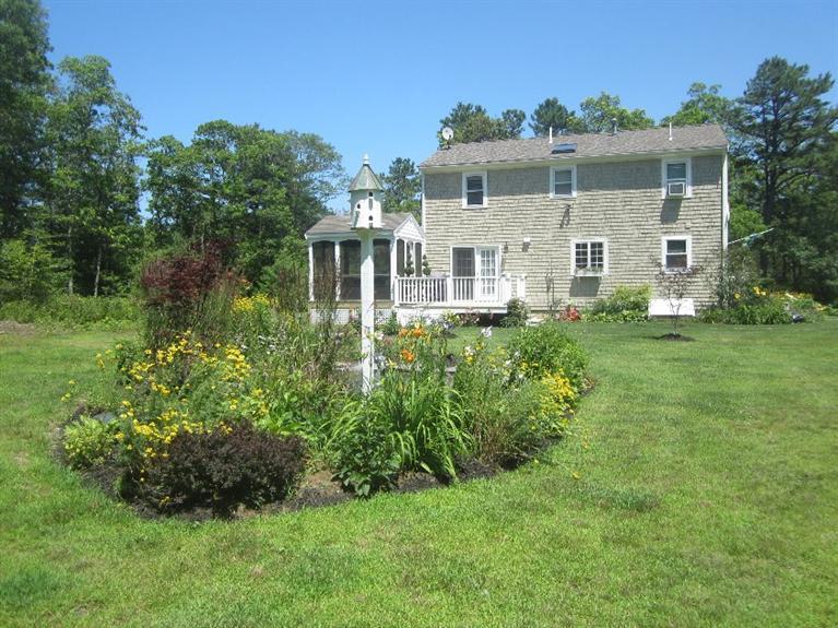 5 Cotuit Road Sandwich, MA 02563 - Photo 31 of 34 a front view of a house with a yard