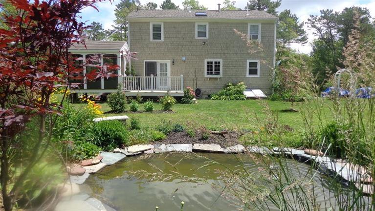 5 Cotuit Road Sandwich, MA 02563 - Photo 32 of 34 a view of a house with swimming pool and a yard