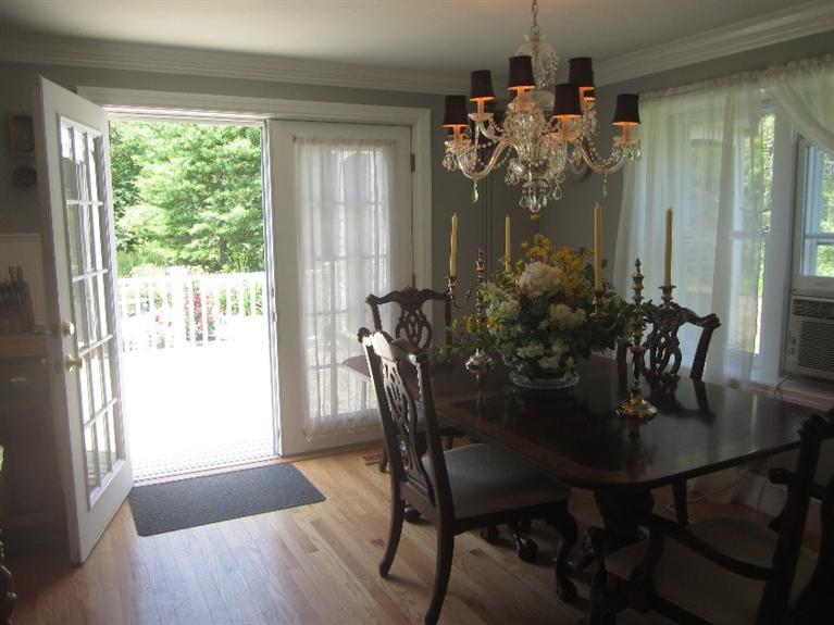 5 Cotuit Road Sandwich, MA 02563 - Photo 9 of 34 a view of a dining room with furniture and chandelier