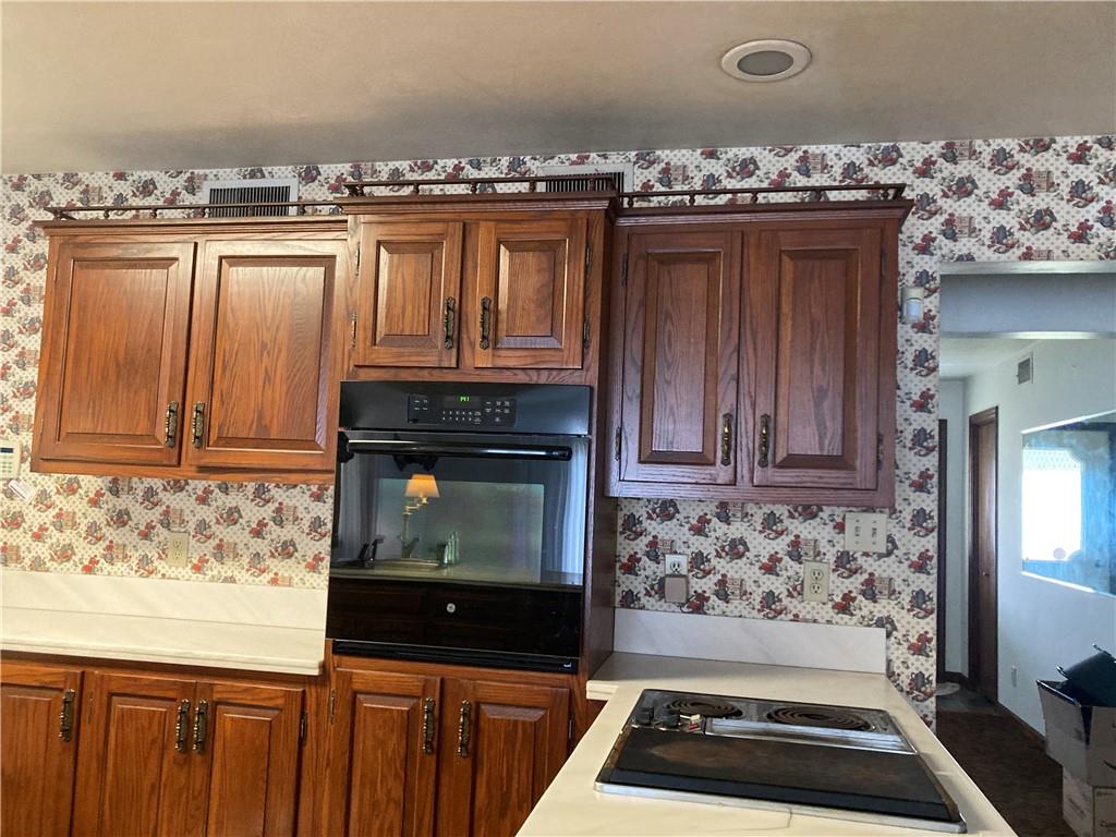 115 Wayne Prospect, PA 16052 - Photo 4 of 21 a kitchen with granite countertop a stove and a microwave
