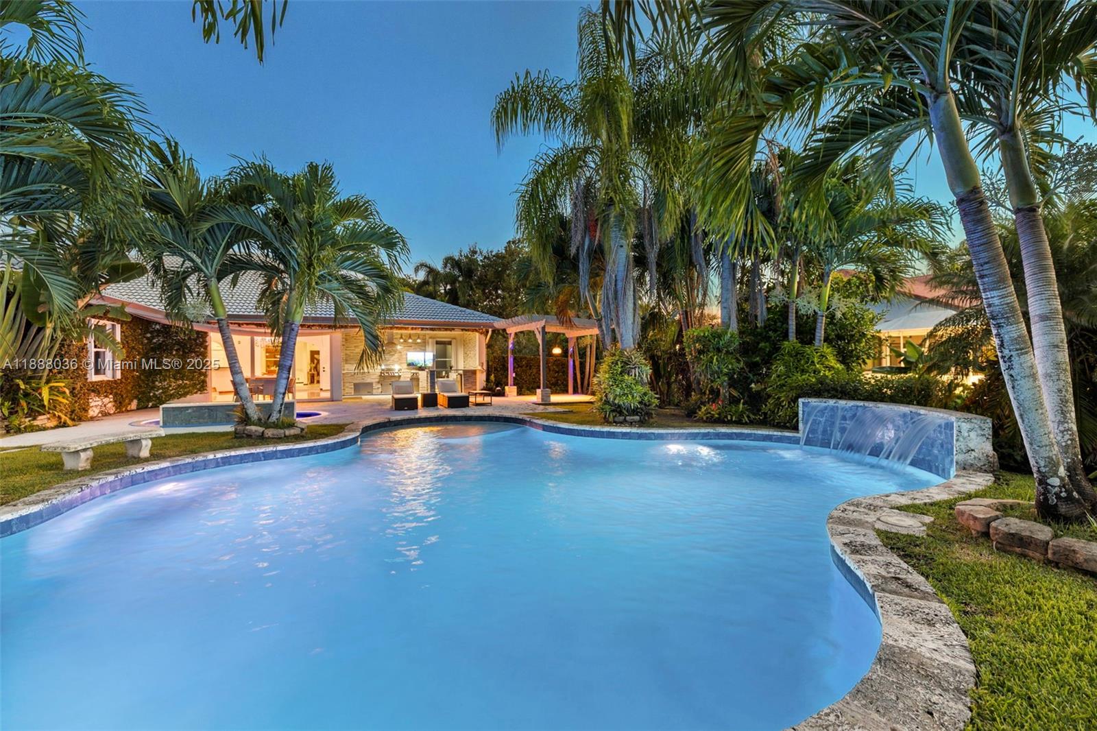12555 Southwest 34th Place Davie, FL 33330 - Photo 11 of 73 a view of a swimming pool with a table and chairs