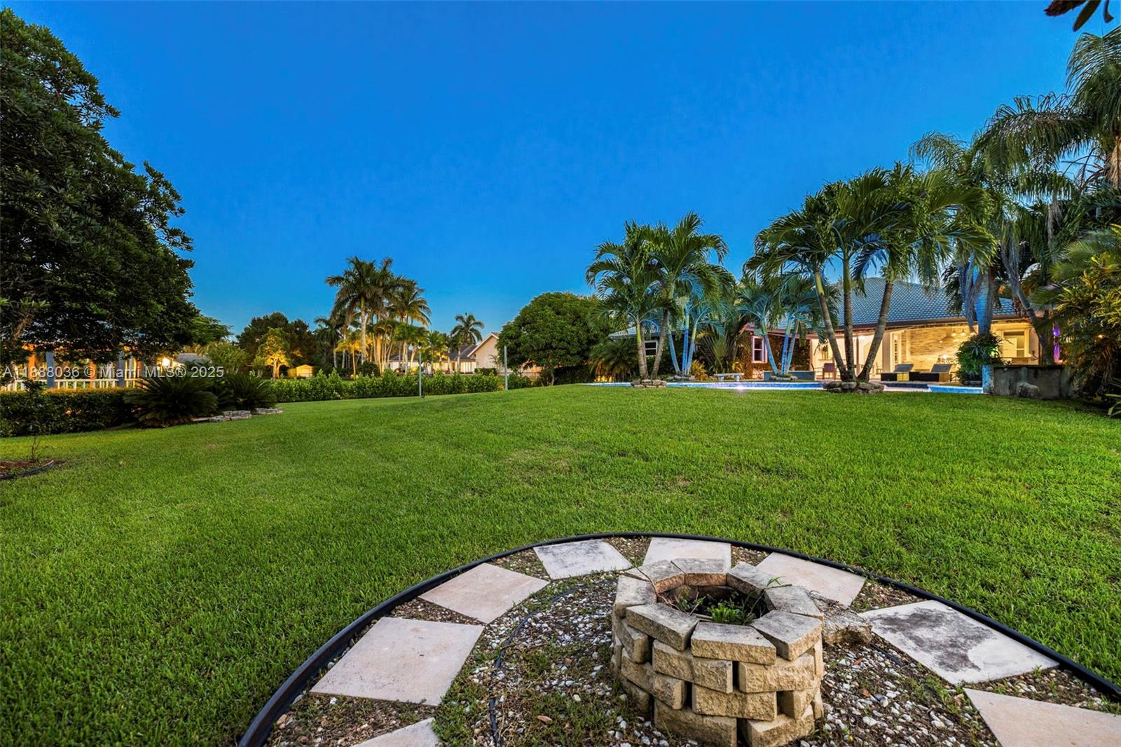 12555 Southwest 34th Place Davie, FL 33330 - Photo 14 of 73 a backyard of a house with lots of green space