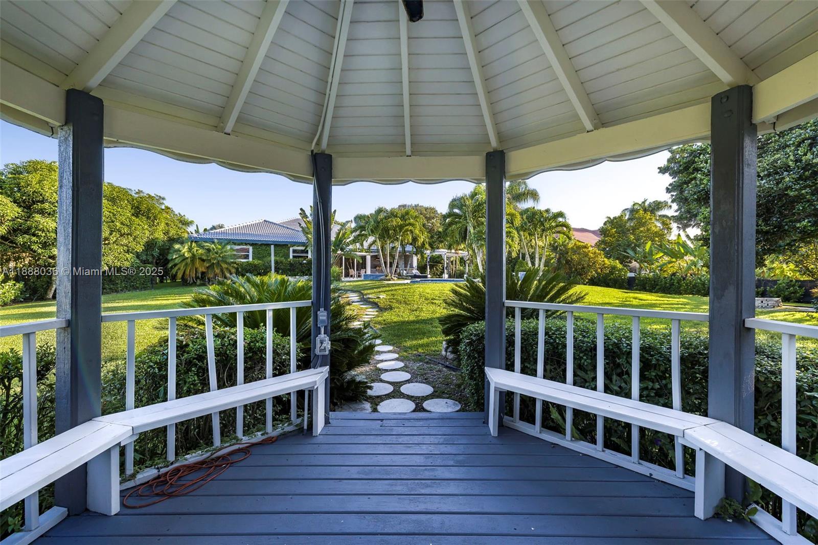 12555 Southwest 34th Place Davie, FL 33330 - Photo 20 of 73 a view of a deck with wooden floor and fence