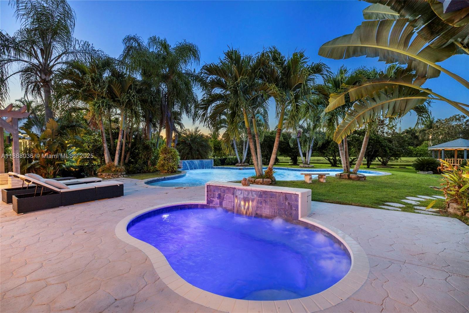 12555 Southwest 34th Place Davie, FL 33330 - Photo 2 of 73 a view of a swimming pool with a patio