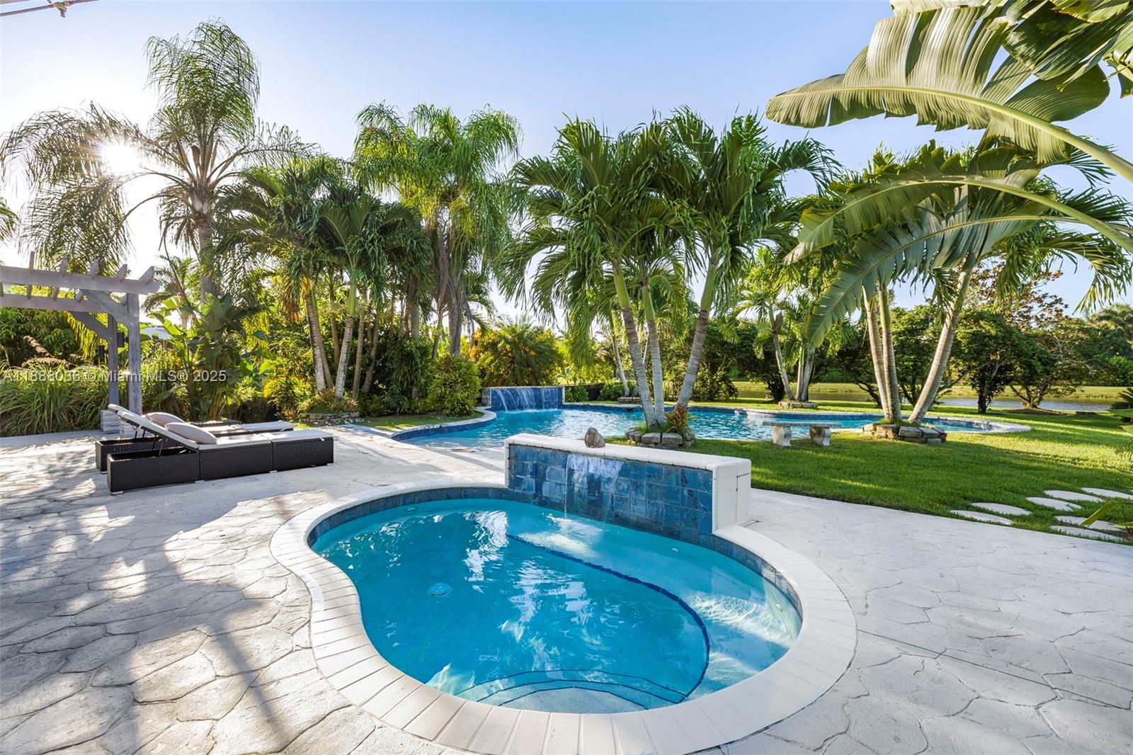 12555 Southwest 34th Place Davie, FL 33330 - Photo 21 of 73 a view of a swimming pool with a patio